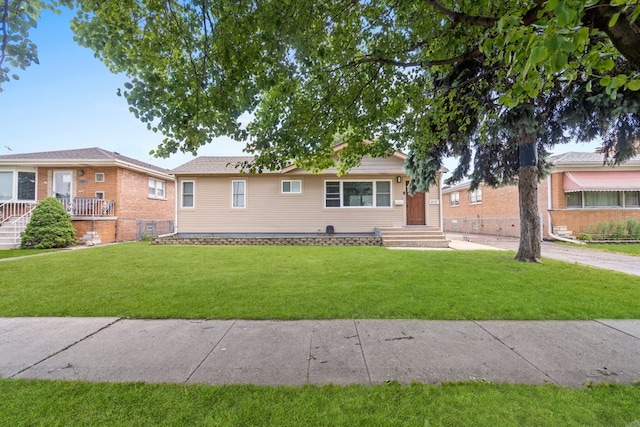 single story home featuring a front yard