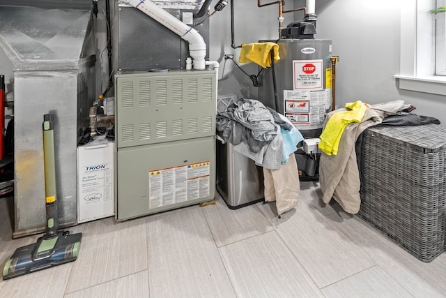 utility room featuring gas water heater