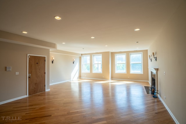 unfurnished living room featuring hardwood / wood-style floors