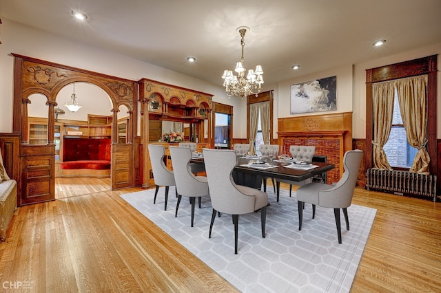 dining space featuring a chandelier, plenty of natural light, and light wood-type flooring