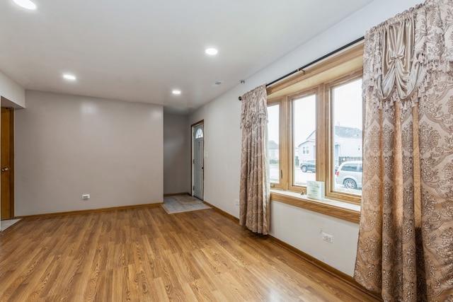 spare room with light wood-type flooring