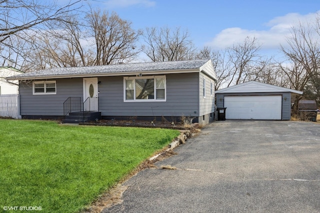 single story home with a garage, an outdoor structure, and a front yard