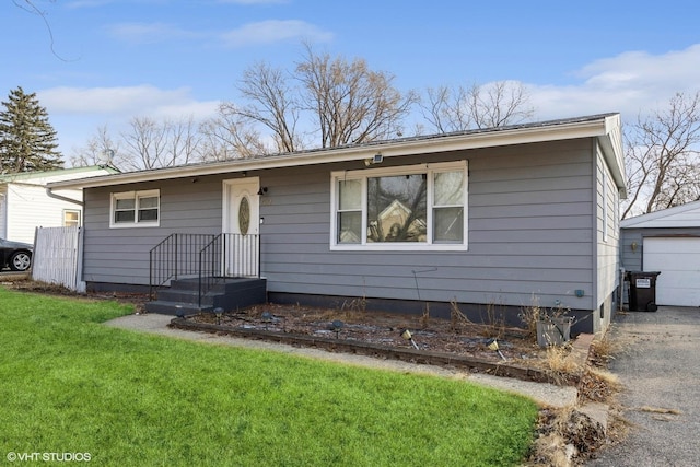 view of front of house with a garage and a front yard