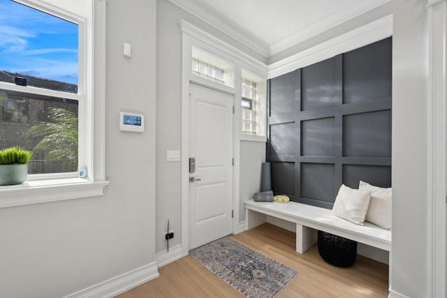 mudroom with hardwood / wood-style flooring and ornamental molding