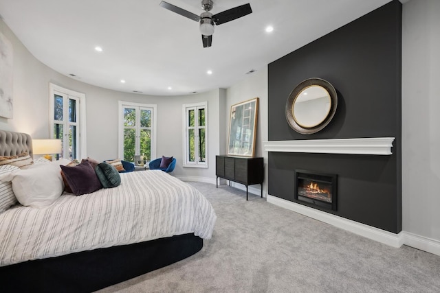 bedroom with light colored carpet and ceiling fan