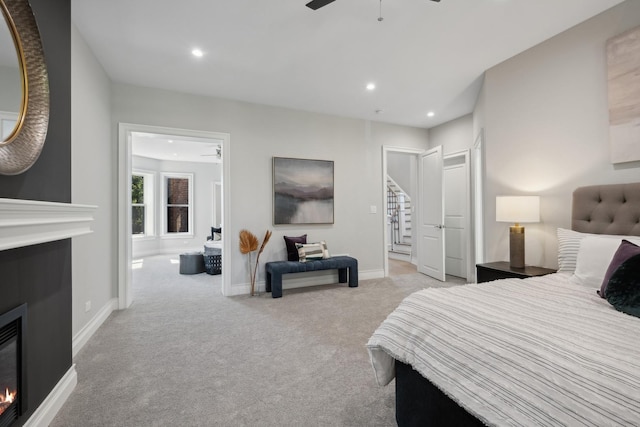 bedroom with light carpet and ceiling fan