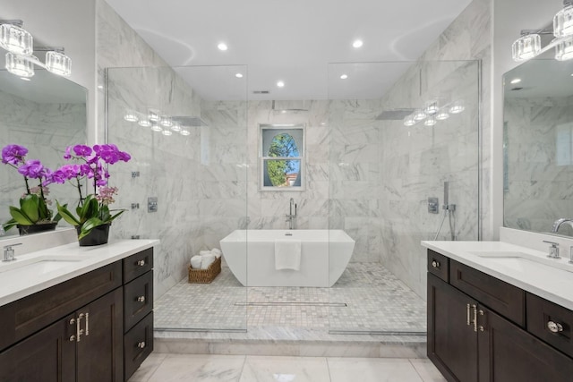 bathroom with vanity, tile walls, and independent shower and bath