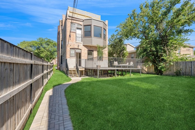 view of yard with a wooden deck