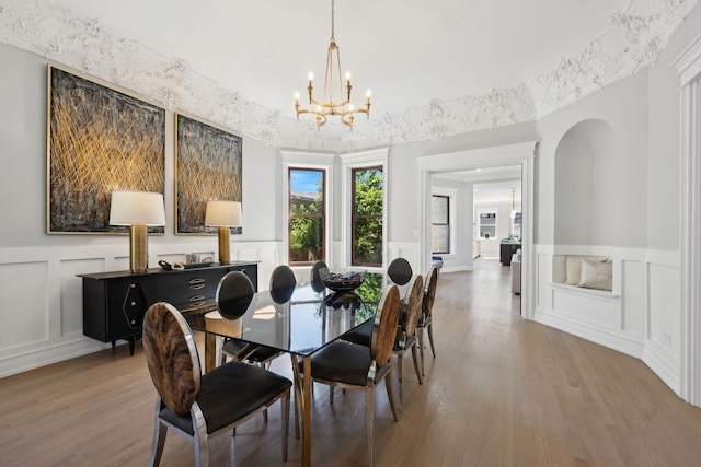 dining area featuring a chandelier and hardwood / wood-style flooring