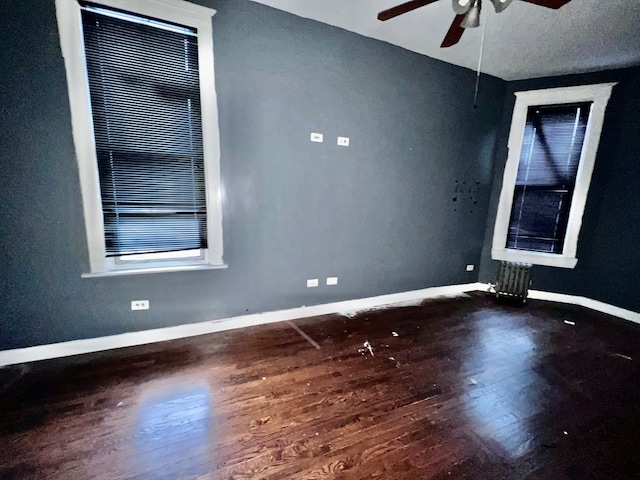 unfurnished room featuring wood-type flooring and ceiling fan