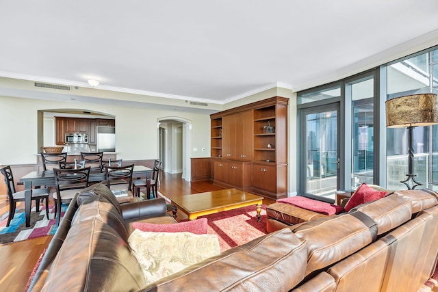 living room featuring hardwood / wood-style floors and ornamental molding