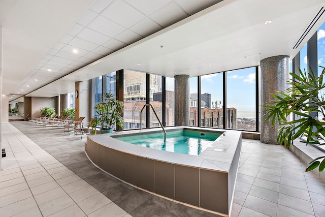 view of swimming pool featuring an indoor in ground hot tub