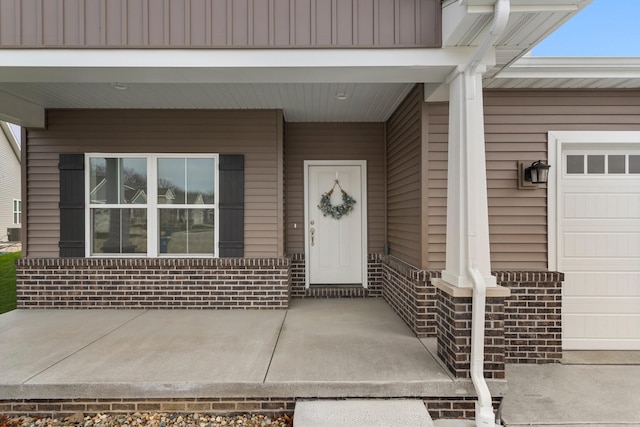 doorway to property featuring a garage