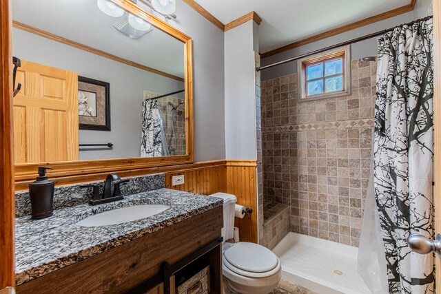 bathroom with curtained shower, ornamental molding, vanity with extensive cabinet space, and toilet