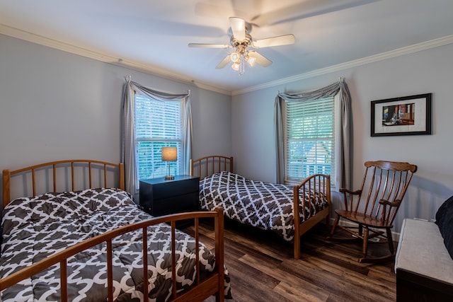 bedroom featuring crown molding, dark hardwood / wood-style floors, and ceiling fan