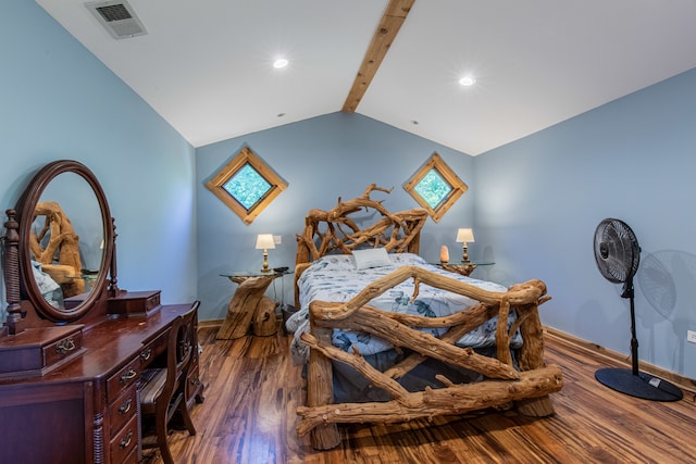 bedroom with multiple windows, vaulted ceiling with beams, and wood-type flooring