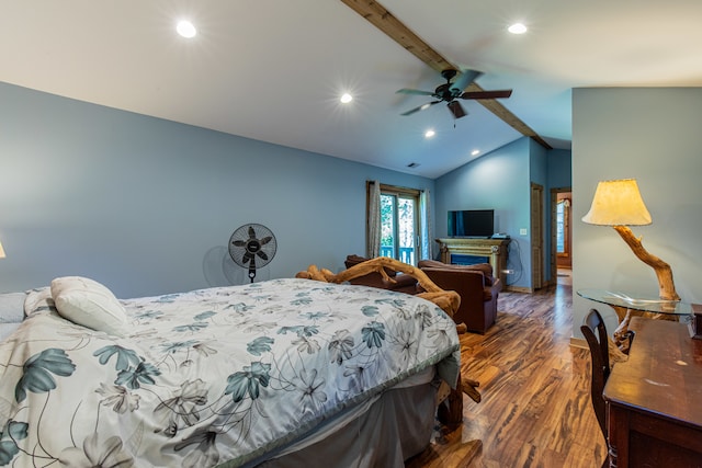 bedroom featuring dark hardwood / wood-style floors, lofted ceiling with beams, and ceiling fan