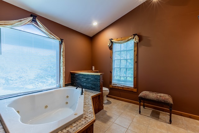 bathroom with a tub, tile flooring, toilet, and lofted ceiling