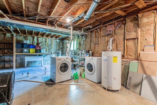 basement with independent washer and dryer, sink, and electric water heater