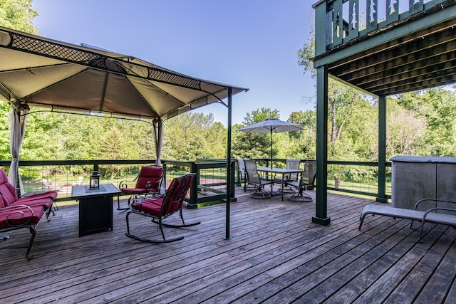 wooden deck featuring a gazebo