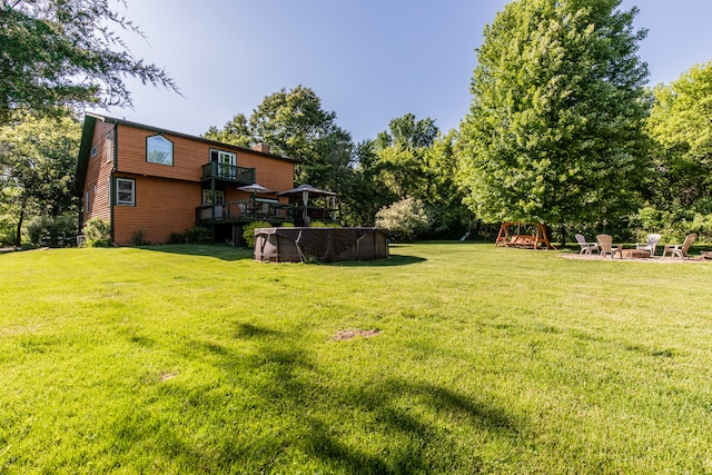 view of yard featuring a wooden deck