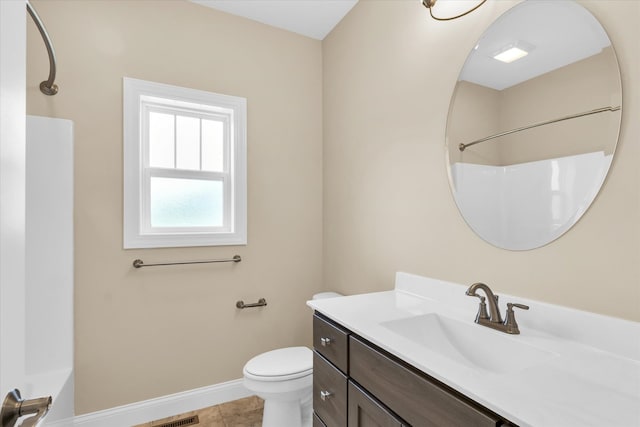 bathroom featuring tile patterned floors, vanity, and toilet