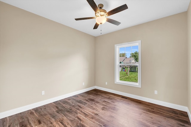 empty room with wood-type flooring and ceiling fan