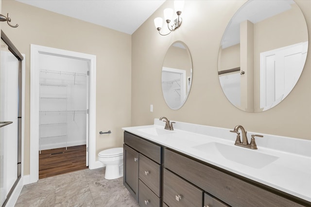 bathroom featuring hardwood / wood-style flooring, toilet, and double sink vanity