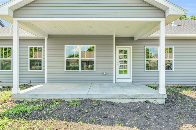 property entrance featuring a patio area