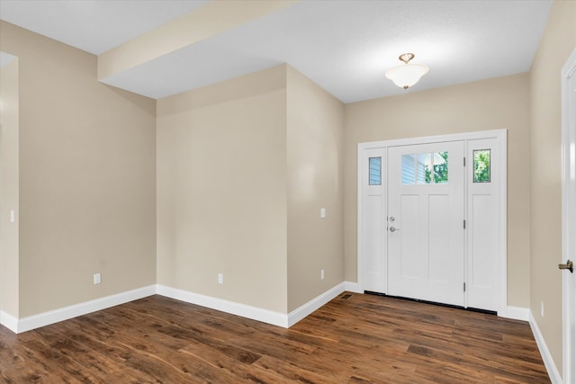 entryway with dark hardwood / wood-style floors