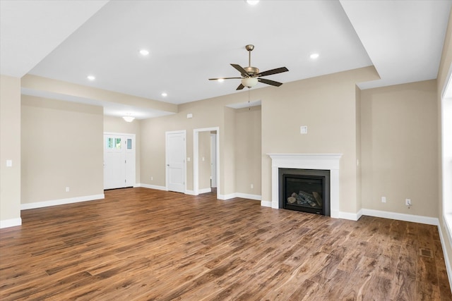 unfurnished living room with hardwood / wood-style flooring and ceiling fan