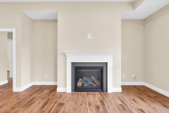 unfurnished living room featuring hardwood / wood-style flooring