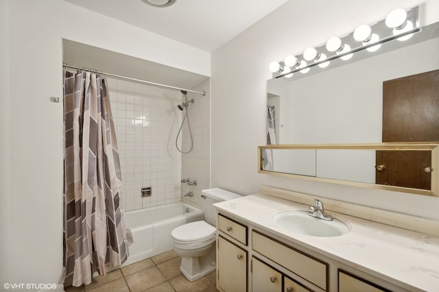 full bathroom with tile patterned flooring, vanity, toilet, and shower / bath combo with shower curtain