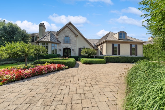 view of french country inspired facade