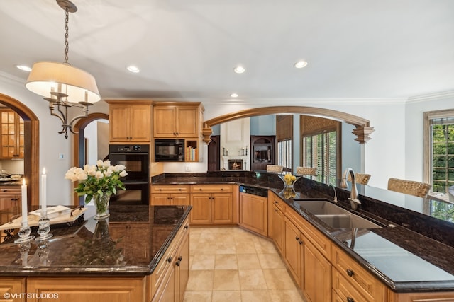 kitchen featuring dark stone counters, sink, black appliances, and light tile floors