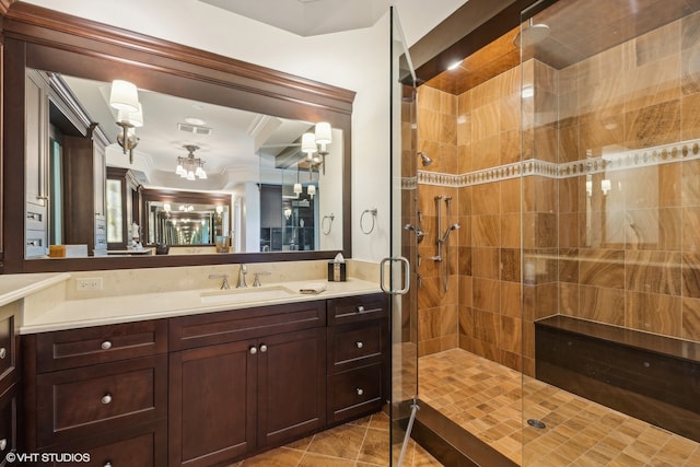 bathroom featuring tile floors, walk in shower, vanity with extensive cabinet space, and crown molding