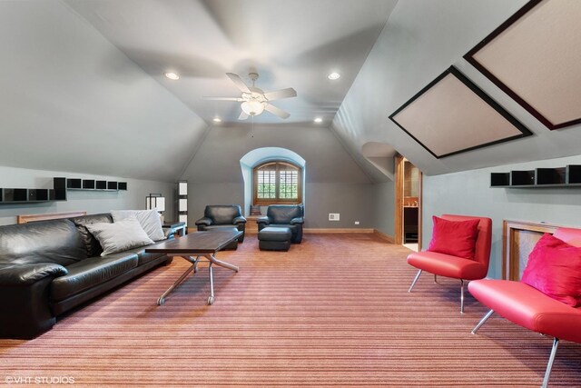 living room with ceiling fan and lofted ceiling