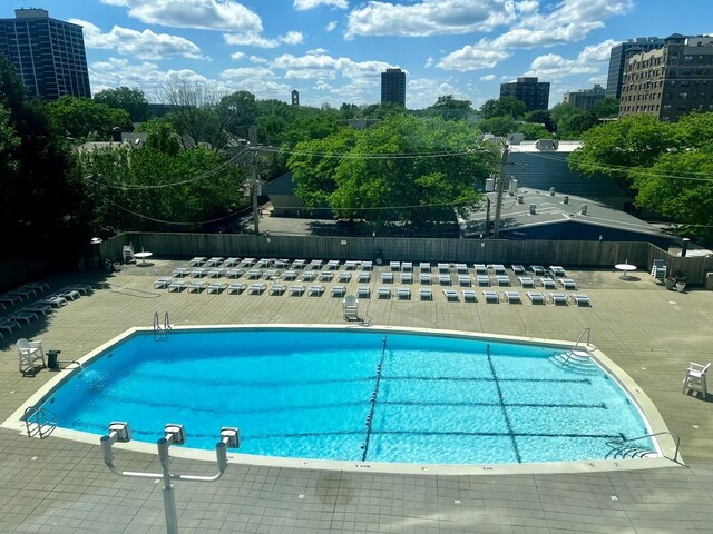 view of swimming pool with a patio