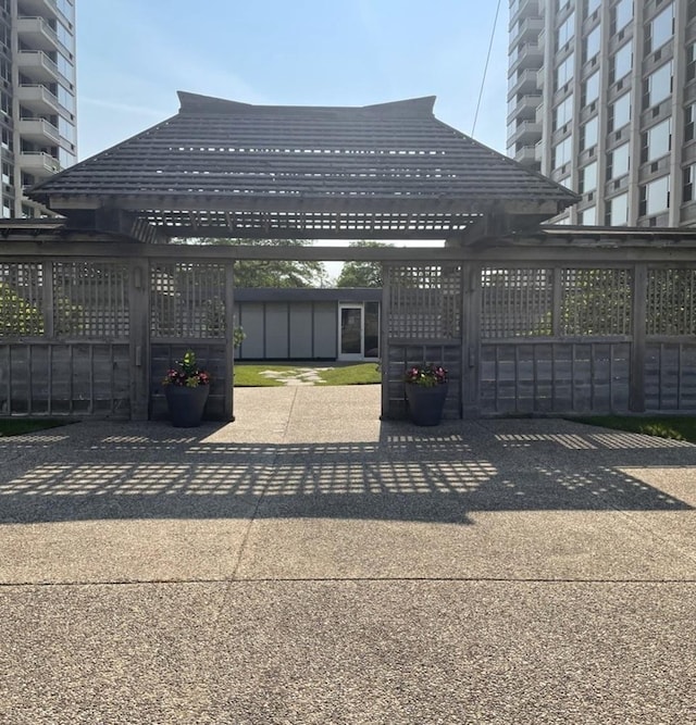 view of gate featuring a pergola