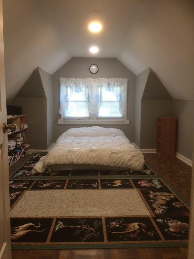 bedroom featuring lofted ceiling