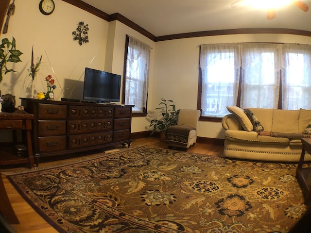 living room with dark hardwood / wood-style flooring and ceiling fan