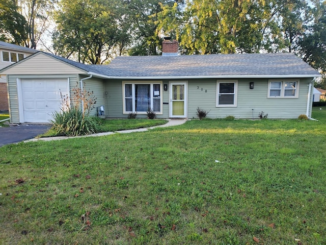308 Minocqua St, Park Forest, IL 60466 - ranch-style home featuring a front yard, a chimney, an attached garage, roof with shingles, and driveway