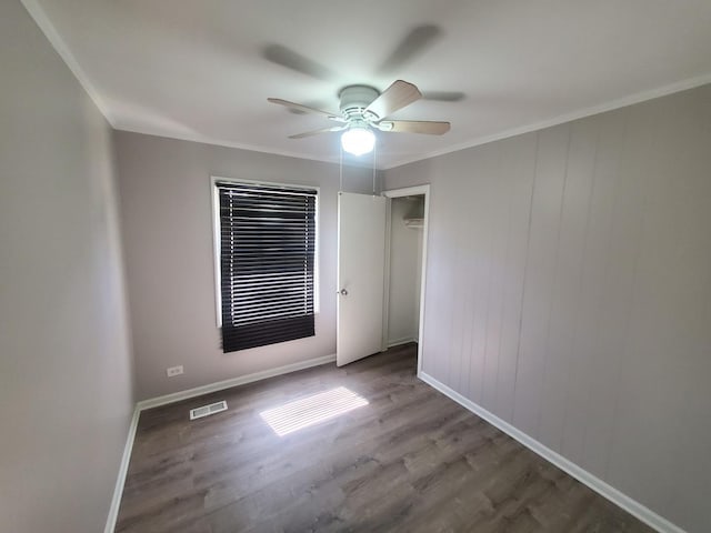 308 Minocqua St, Park Forest, IL 60466 - spare room with a ceiling fan, wood finished floors, crown molding, and baseboards