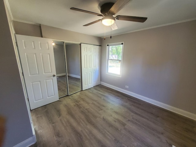 unfurnished bedroom featuring ceiling fan, wood-type flooring, and ornamental molding