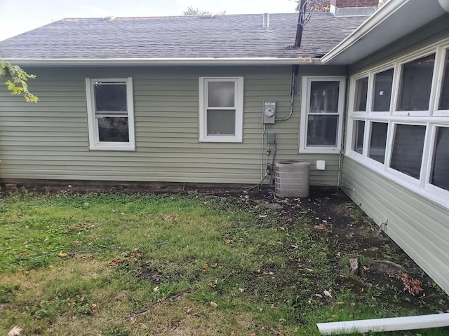 308 Minocqua St, Park Forest, IL 60466 - view of home's exterior with a shingled roof, a lawn, and central AC