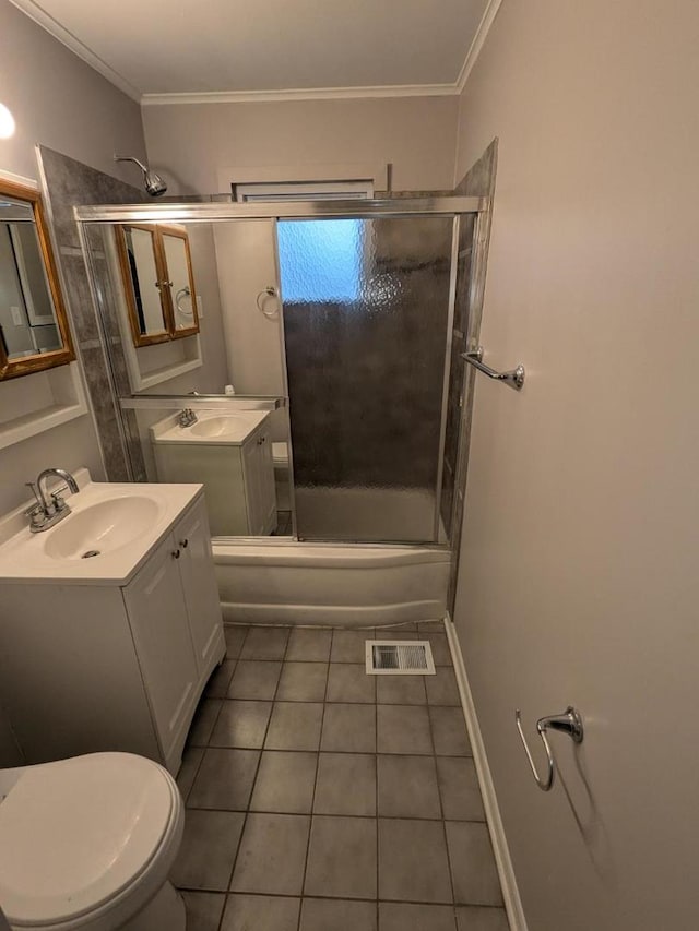 full bathroom with vanity, tile patterned flooring, toilet, enclosed tub / shower combo, and ornamental molding