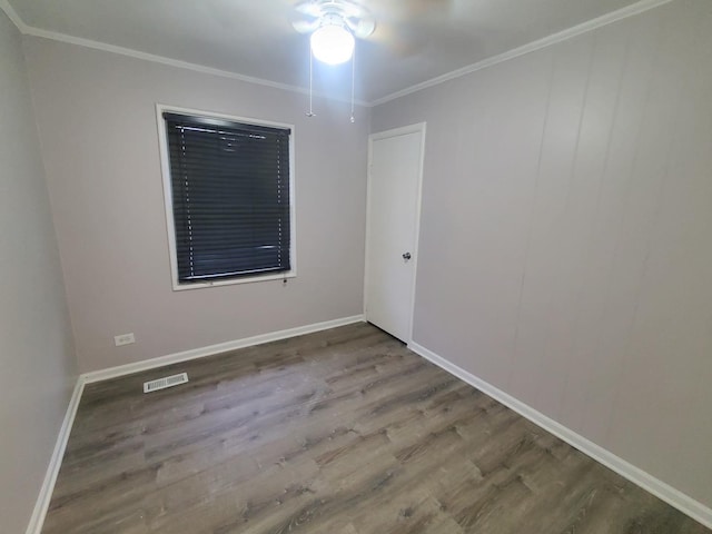 308 Minocqua St, Park Forest, IL 60466 - spare room with wood finished floors, crown molding, and baseboards