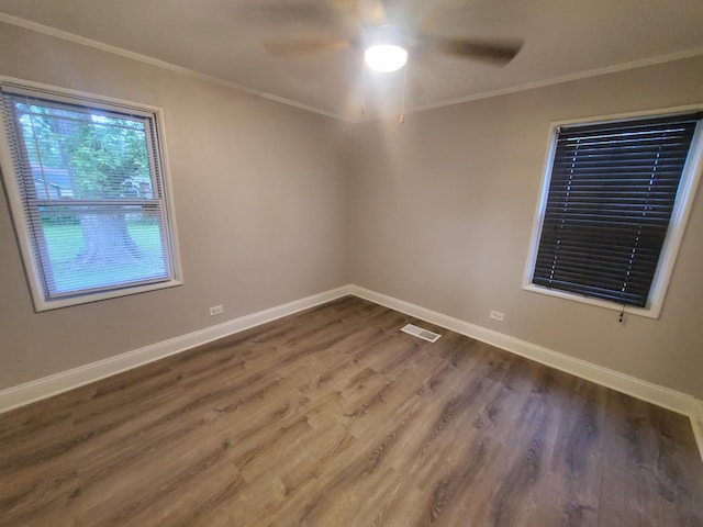 308 Minocqua St, Park Forest, IL 60466 - spare room featuring ceiling fan, crown molding, dark wood-style floors, and baseboards