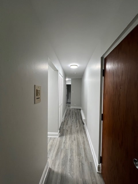 corridor featuring light wood-type flooring