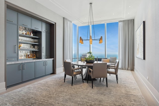 dining area featuring a wall of windows